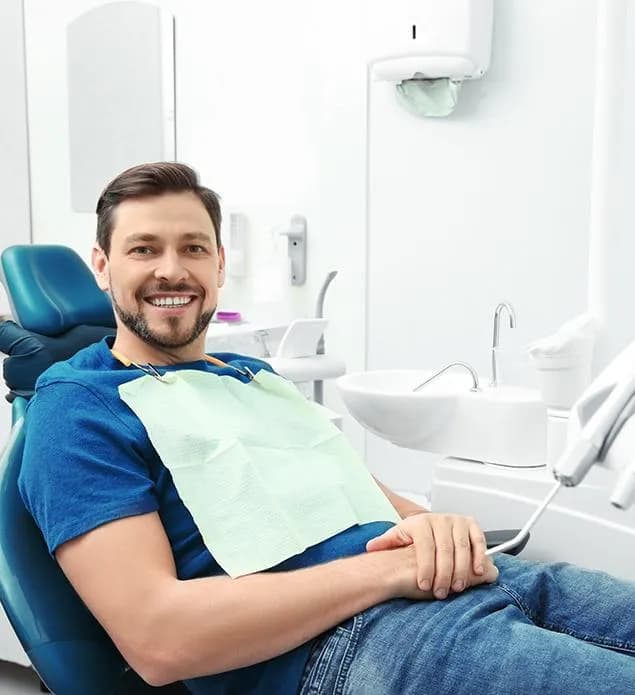Dentist examining a patient during a general dentistry visit