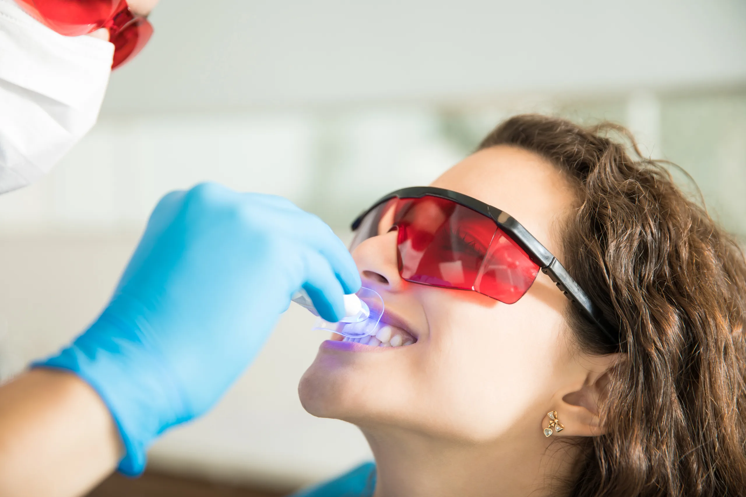 Happy patient showing off bright white teeth after whitening