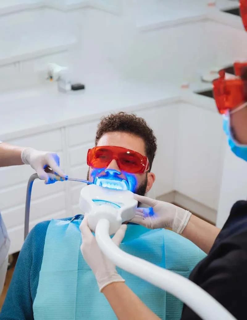 Woman with a bright white smile after professional teeth whitening